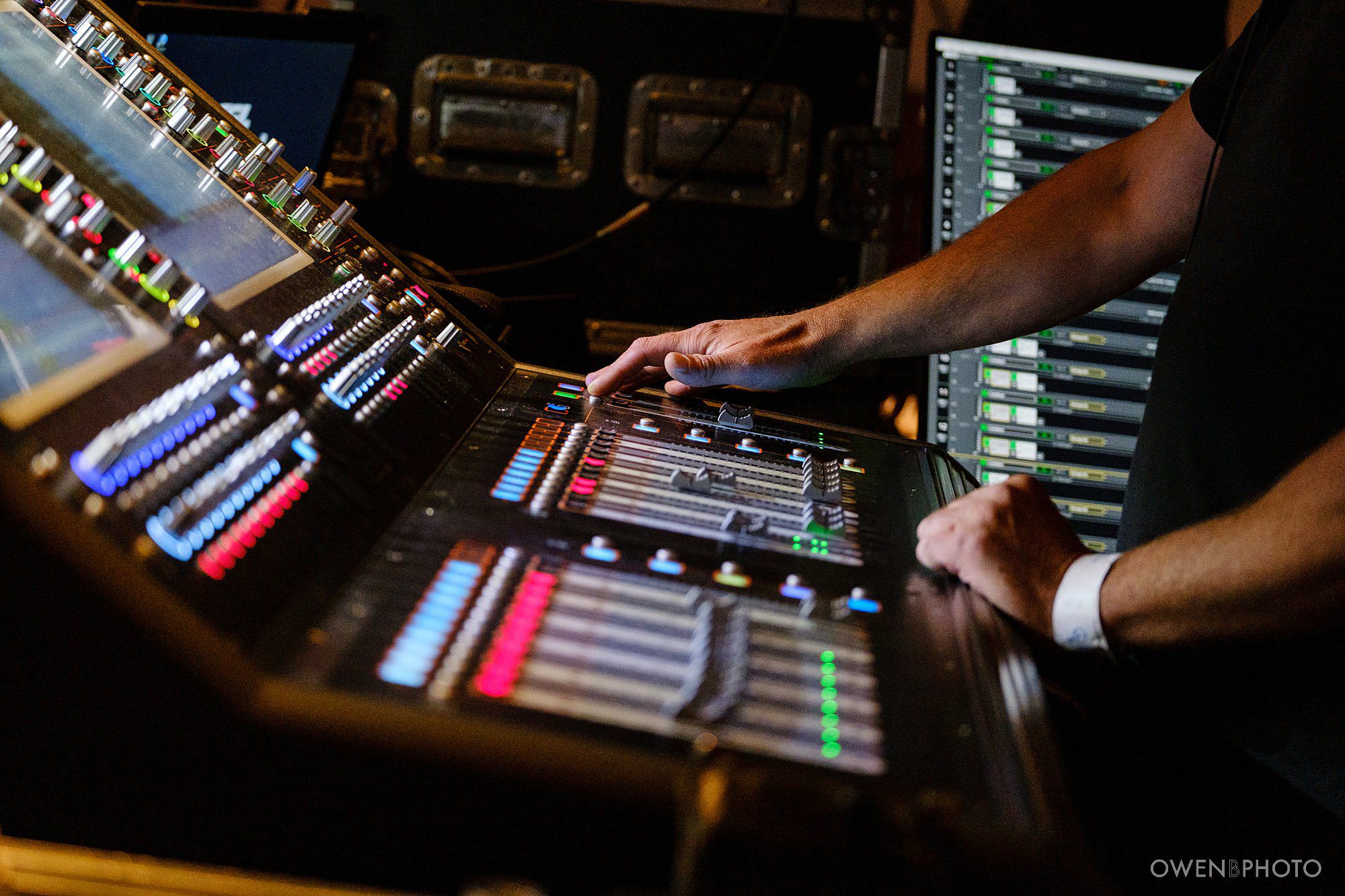 Production crew operating the sound desk at Peace One Day at the Globe theatre, by London PR Photographer Owen Billcliffe