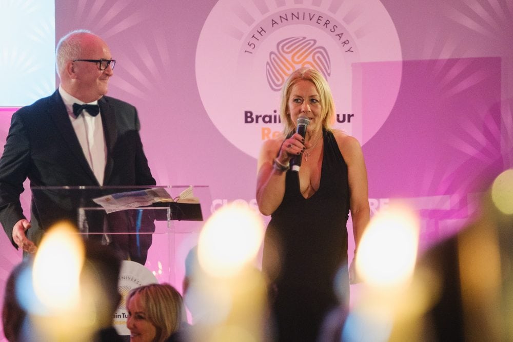 Sarah Beeny giving a speech at the Alfie Boe performing at the Brain Tumour Research gala in the ballroom at The Dorchester, London