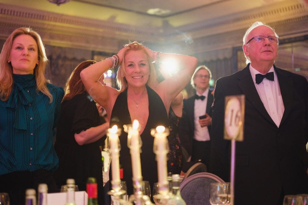 Sarah Beeny playing Heads Or Tails at the Alfie Boe performing at the Brain Tumour Research gala in the ballroom at The Dorchester, London