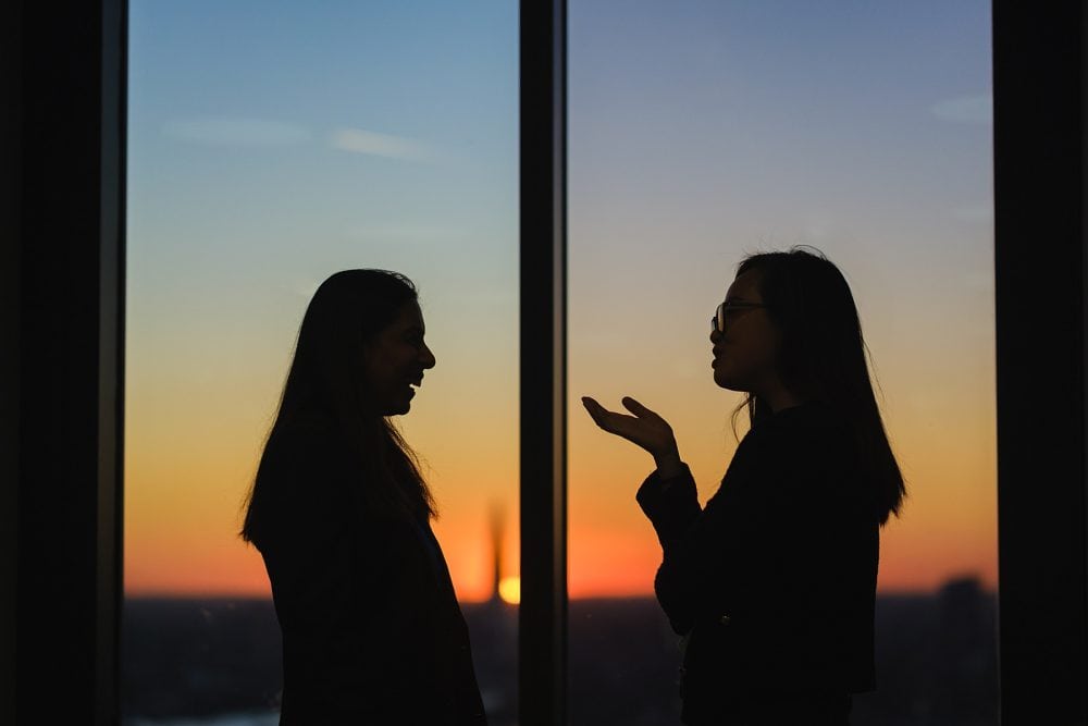 guests at a Level39 event with the sunset in the background