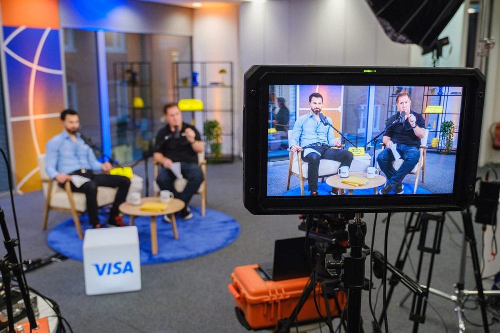 behind the scenes shot showing camera monitor during filming of the Money Travels podcast for VISA direct
