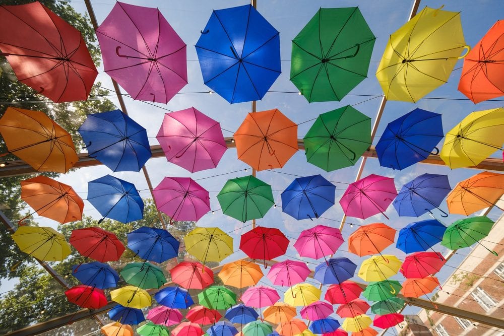 detail shot of colourful umbrellas in the covered decking at summer party