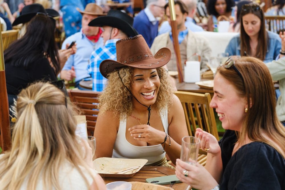 guests enjoying the street food on the lawns at a summer party at regent's university