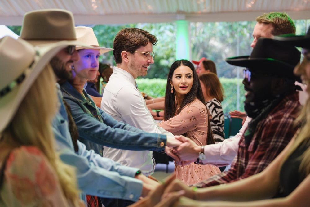 Guests participating in line dancing at Regent’s University summer event