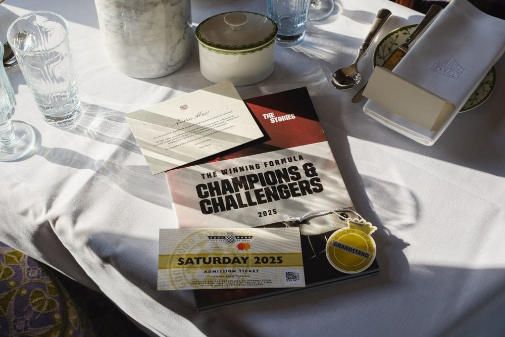 Close-up of customised tickets and branded details laid out for guests