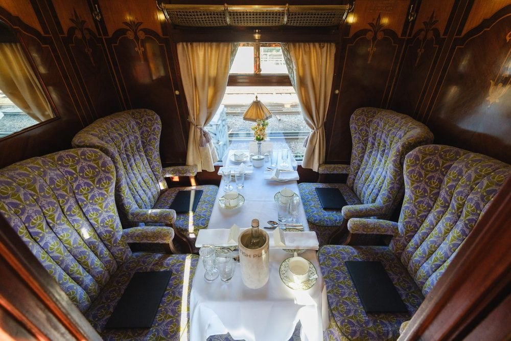 Luxury table setup with polished cutlery and aligned tablecloths in the Pullman