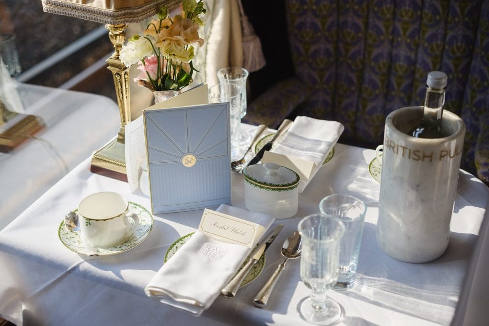 Polished table setting inside the Pullman train, highlighting luxury detailing