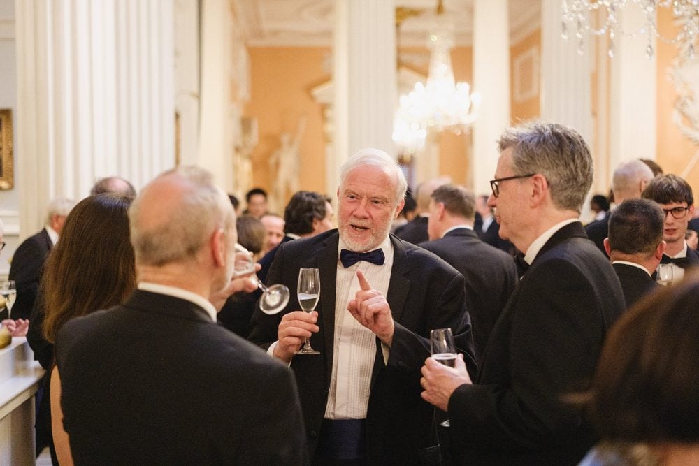 Candid coverage of guests in conversation during drinks reception at Mansion House
