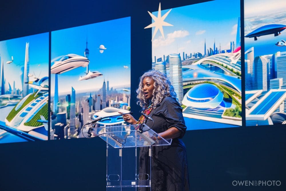 Keynote speaker on stage in the Vision Hall main hall