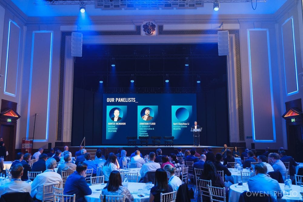 Large presentation screens and stage setup at Vision Hall