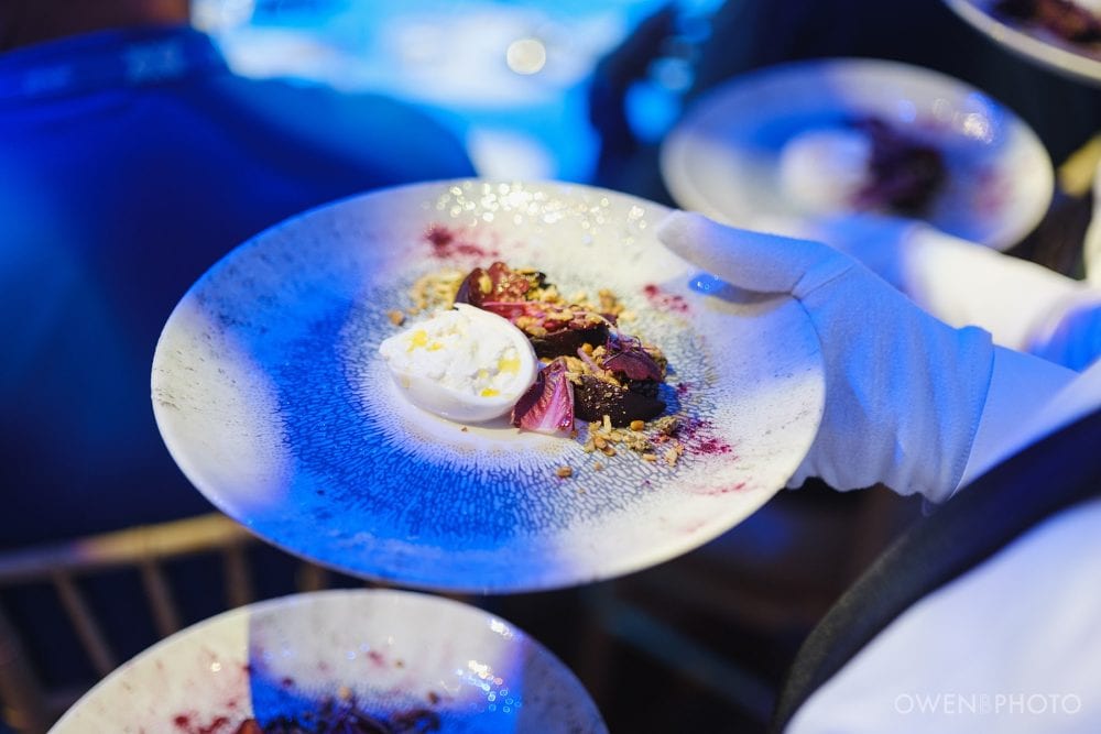 Food service during a corporate dinner inside Vision Hall