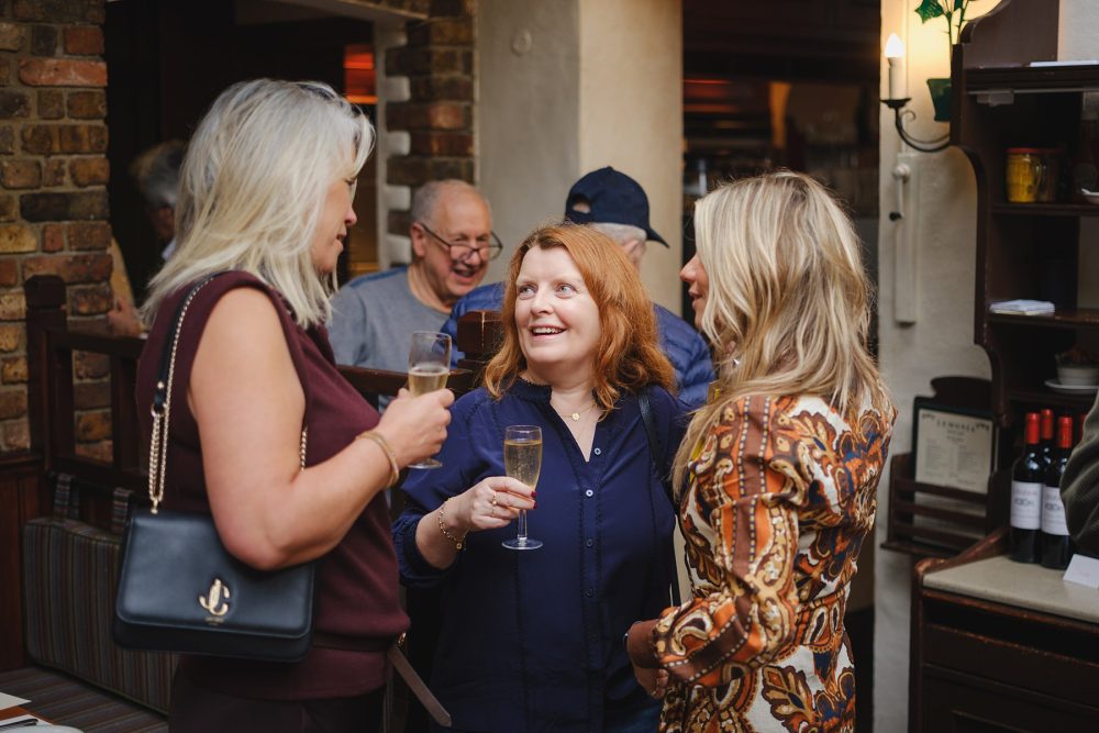Guests exchanging greetings at Lemonia, North London