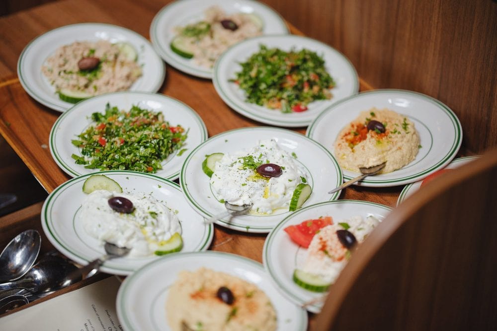 Plates of Greek dishes served at Lemonia for celebration