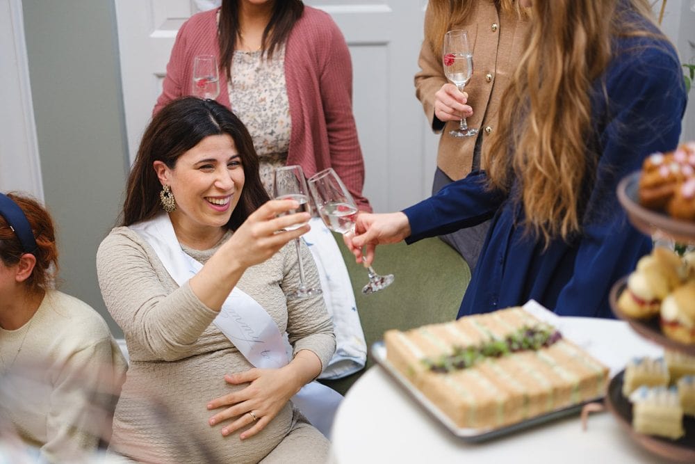 Guests enjoying cakes and treats, photographed at the event