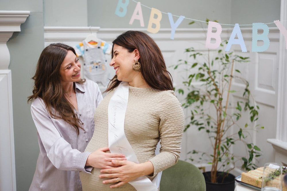 Candid laughter between friends during a baby shower