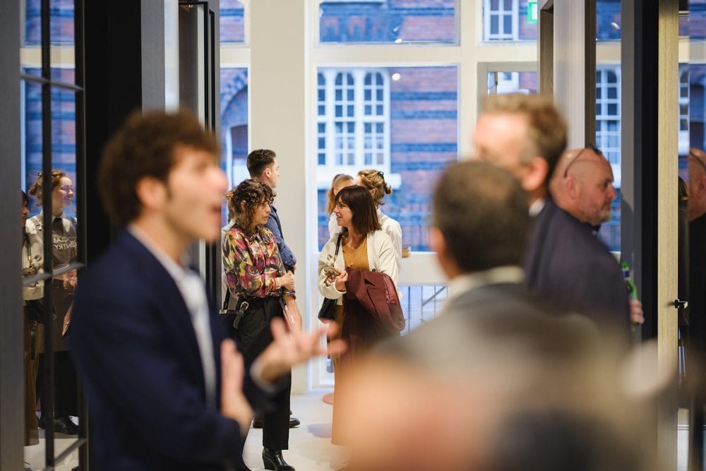 guests chatting at Lualdi London, photographed for a showroom launch event