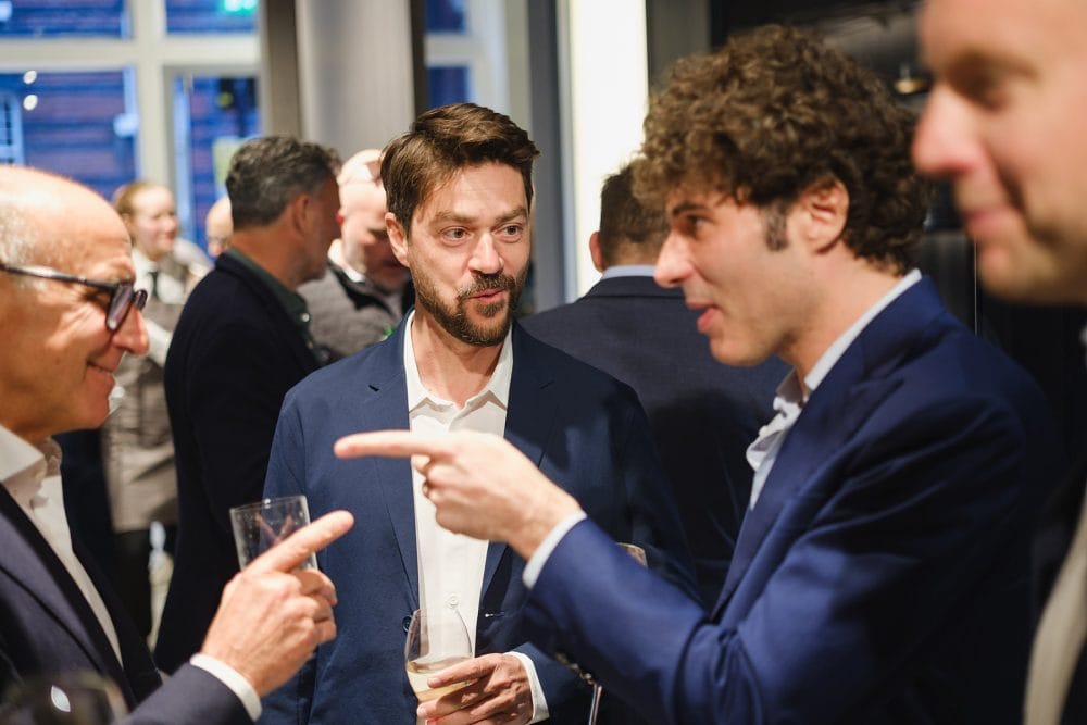 guests chatting at Lualdi London, photographed for a showroom launch event