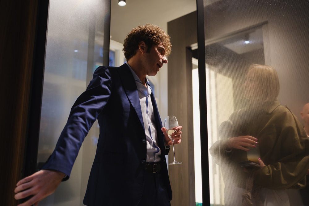 the event host showing guests around the showroom, photographed for a showroom launch event