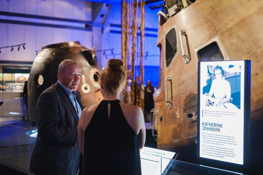 guests enjoying a chat by an exhibit at an event at London Science Museum