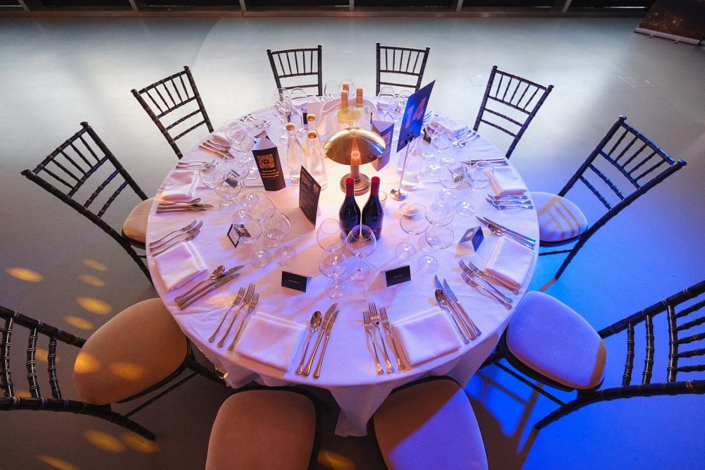 overhead shot of a table set up for dinner in Illuminate at the London Science Museum