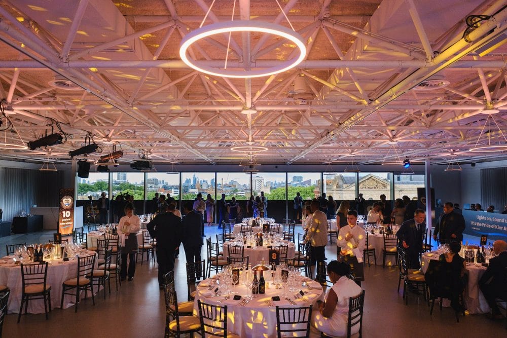 wide shot of guests mingling in Illuminate during an event at the London Science Museum