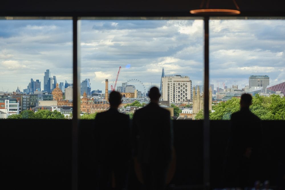 guest sillhouettes by the panoramic windows in Illuminate at the London Science Museum